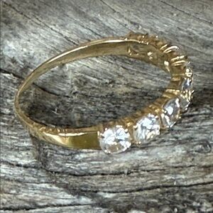 Suzanne Kalan “Glisten Up” gold and white sapphire ring.